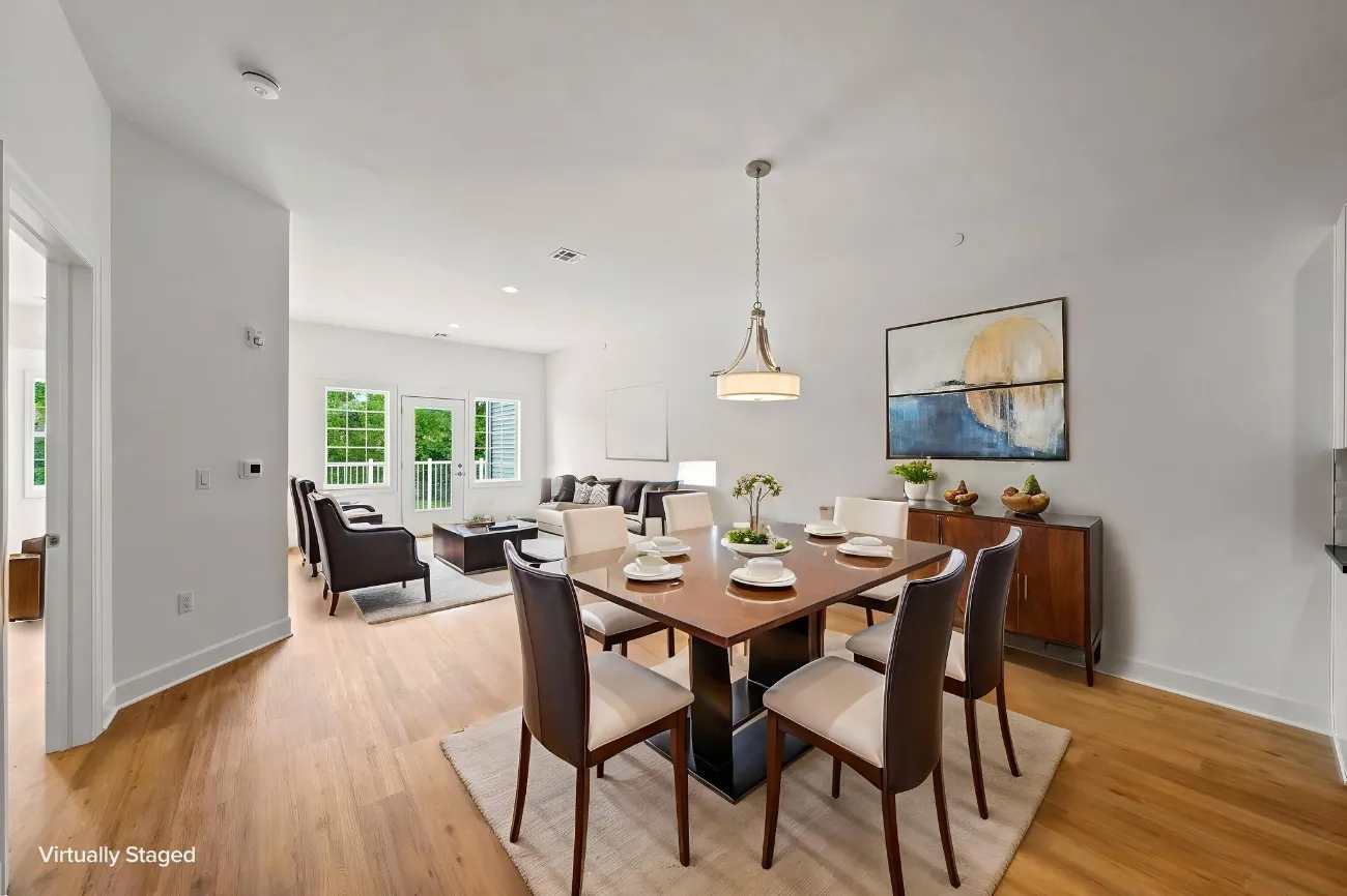 Dining area open to the living room, furnished